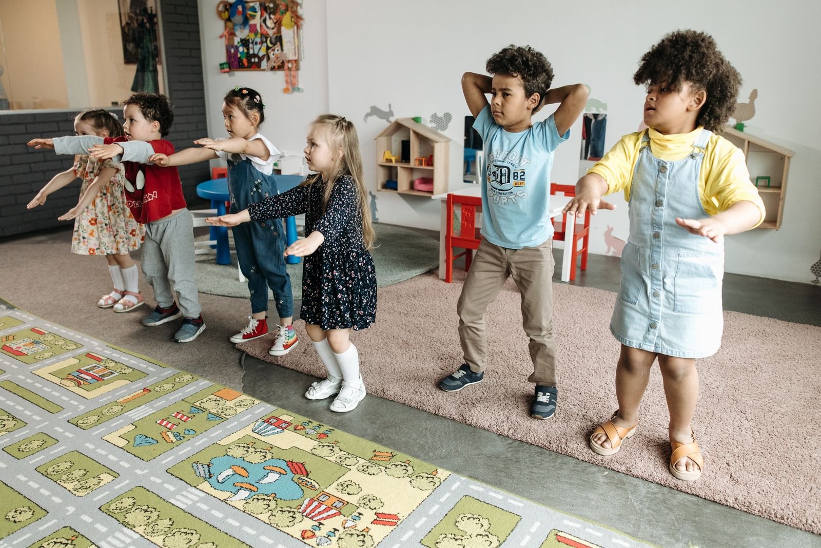 Children practising movement and dance in a classroom
